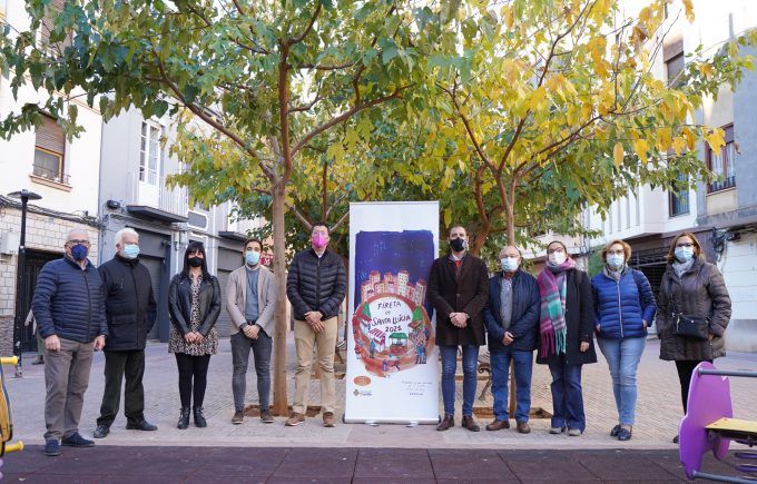 Donate, Braina y Navarro con el cartel de la feria de Santa Llúcia